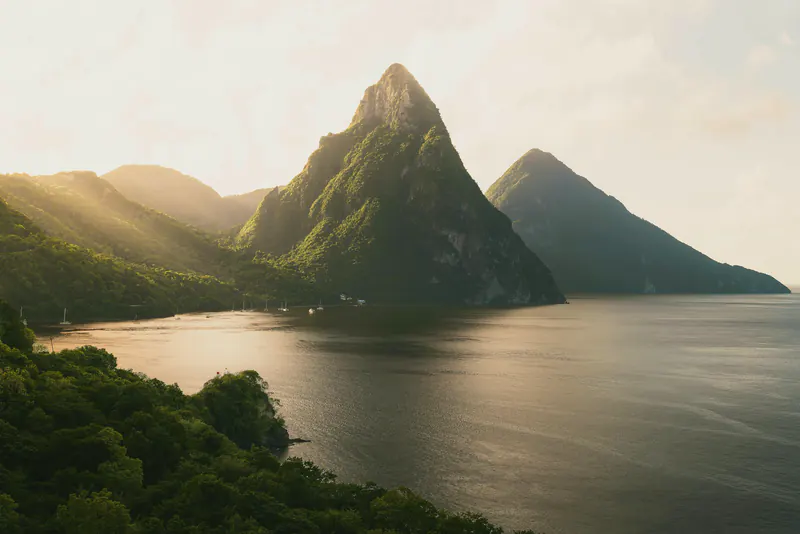 The Pitons rising above the sea in Saint Lucia